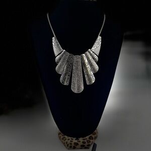 Antique-style silver fan necklace with intricate details